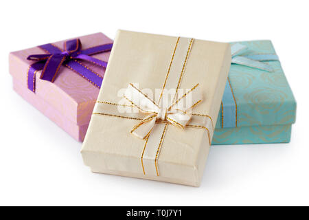 Three gift boxes with bow isolated on white background Stock Photo