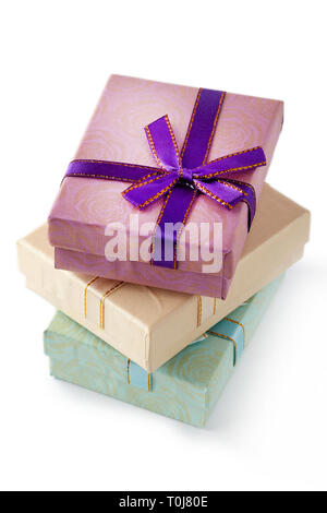 Three gift boxes with bow isolated on white background Stock Photo