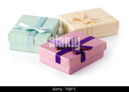 Three gift boxes with bow isolated on white background Stock Photo