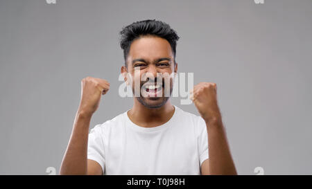 indian man celebrating victory Stock Photo
