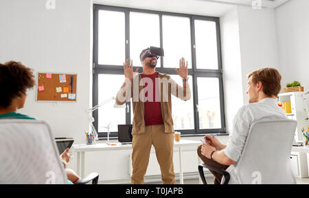 developers with virtual reality headset at office Stock Photo