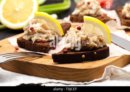 minced herring fillet with apple and egg on toasted rye bread, homemade traditional Jewish cuisine dish forshmak, snack or appetizer Stock Photo