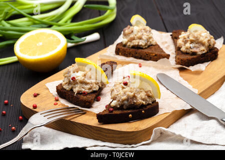 minced herring fillet with apple and egg on toasted rye bread, homemade traditional Jewish cuisine dish forshmak, snack or appetizer Stock Photo