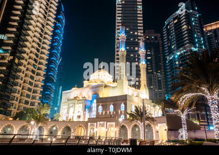 Beautiful new mosque in front of the amazing skyline of dubai marina - emirates Stock Photo