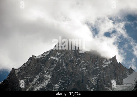 Aiguille du Midi covered by clouds Stock Photo