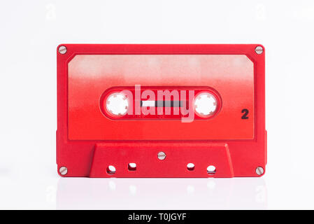 Audio Cassete Red on white background Stock Photo