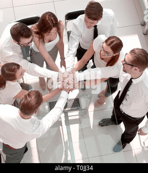 top view.employees of the company making a tower out of hands Stock Photo