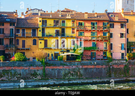 Colorful houses facades near the Adige river bank, Verona, Italy. Stock Photo