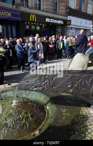 Warrington, Cheshire, UK. 20th Mar, 2019.  at 12:27 - The 26th anniversary of the second IRA bomb in Warrington, Cheshire, which took the lives of Tim Parry and Jonathan Ball. 26 years on and a service was held in Bridge Street, Warrington, at the place and time of the killings. Water was then collected from the ‘River of Life', a memorial to the two young boys that were killed, and moved to the ‘Peace Centre' where it was poured on the roots of the Peace Tree Credit: John Hopkins/Alamy Live News Stock Photo