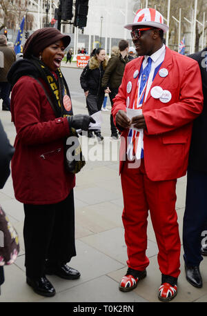 London, UK. 20th Mar, 2019. Pro and Anti Leaving the European Union campaigners discuss outside the entrance to UK Parliament, in London, Wednesday, March 20, 2019. British Prime Minister Theresa May says she has 'great personal regret' that the U.K. won't leave European Union with a deal next week and it's time for her country's lawmakers to decide what they want to do about Brexit. Credit: Petr Kupec/CTK Photo/Alamy Live News Stock Photo