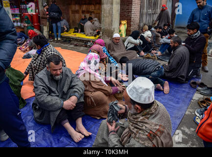 March 21, 2019 - Srinagar, Jammu and Kashmir, India - Kashmiri patients seen receiving leech treatment.A traditional health worker uses leeches to suck impure blood as part of a treatment at Hazratbal on the banks of the Dal Lake on the outskirts of Srinagar Summer capital of Indian administered Kashmir. Every year traditional health workers in Kashmir use leeches to treat people for itchy, painful lumps that develop on the skin called chilblains acquired during winter. Thousands of patients suffering from various skin problems receives leech treatment at Hazratbal in Srinagar. (Credit Image: Stock Photo