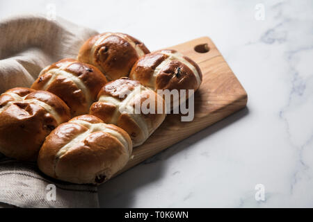 Traditional hot cross buns with raisins. Easter springtime treat Stock Photo