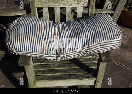Blue and White Stripe Bolster with Tic Material Interior Stock Photo
