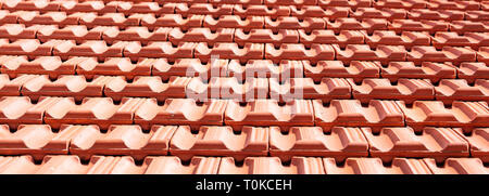 Roofing construction. Red roof ceramic tiles texture background. Stock Photo