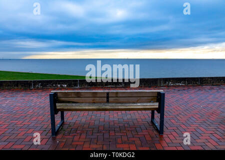 Wilhelmshaven, south beach, park bench on the dike, Jadebusen,East Frisia, Northern Germany, North Sea Coast, Stock Photo