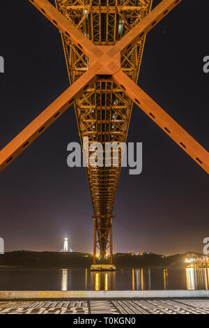 Ponte 25 de Abril in Lisbon, Cristo Rei statue, sunset, Portugal Stock Photo