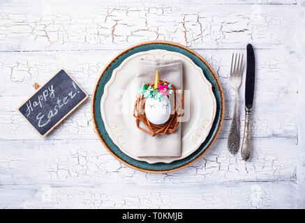 Easter table setting with quail eggs Stock Photo