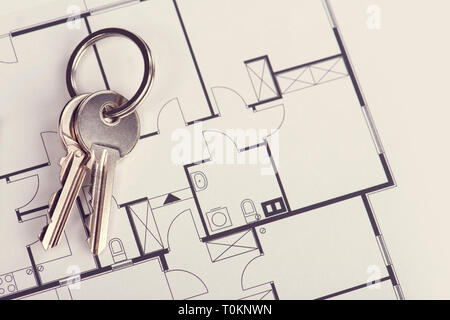 Toned and selective focus image. Bunch of keys on the house plan Stock Photo