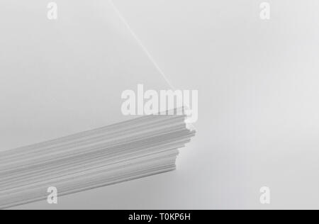 Stack of blank white paper on white background Stock Photo