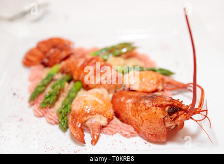 Prepared bretagne lobster on porcelain plate Stock Photo
