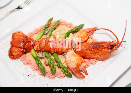 Prepared lobster on porcelain plate, place setting Stock Photo