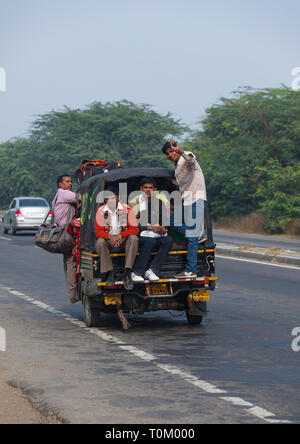 AGRA, INDIA - NOVEMBER 15, 2012: Traditional Indian family travels by car. Indian people and their colorful culture Stock Photo