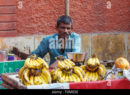 AGRA, INDIA - NOVEMBER 16, 2012: Traditional trade in India with fruits, vegetables, nuts and spices Stock Photo