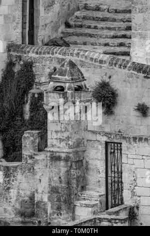 Amazing close-up black and white view of beautifully ornamented chimney in ancient town of Matera, the Sassi di Matera, Basilicata, Southern Italy, ar Stock Photo