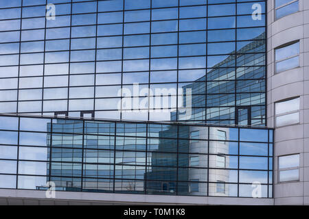 Reflections in glass building, modern architecture, building exterior