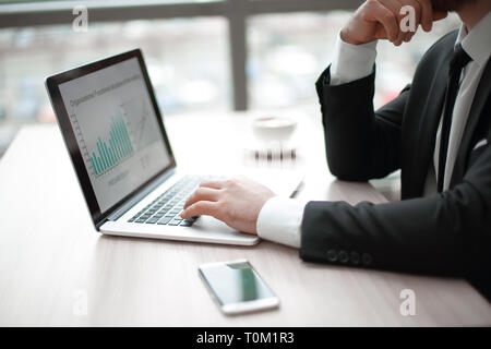 businessman working with financial charts on the laptop. Stock Photo
