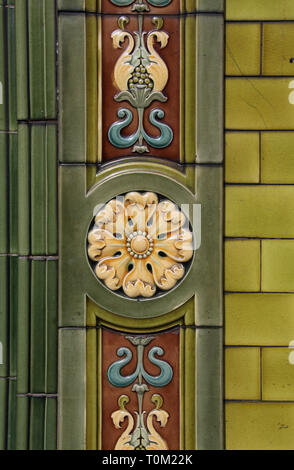 Tiled exterior of the historic Peveril of the Peak pub in Manchester city centre