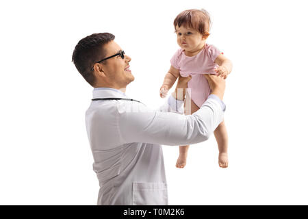 Young male doctor holding a baby girl up in the air isolated on white background Stock Photo