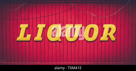 Grungy Urban Red And Yellow Liquor Store Sign Stock Photo