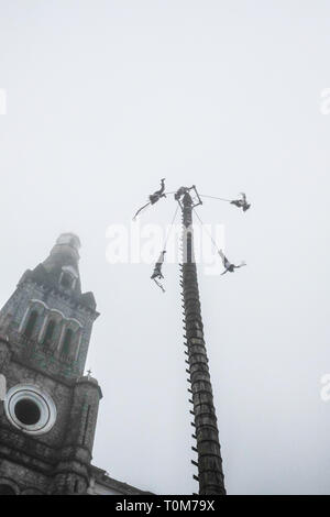 Flying Dancers in the air at Cuetzalan town center, Mexico Stock Photo