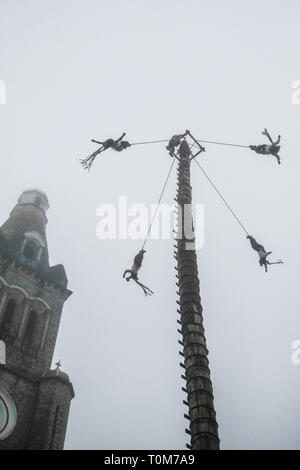 Flying Dancers in the air at Cuetzalan town center, Mexico Stock Photo