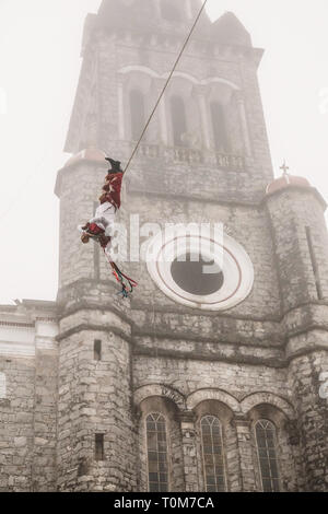 Flying Dancers in the air at Cuetzalan town center, Mexico Stock Photo