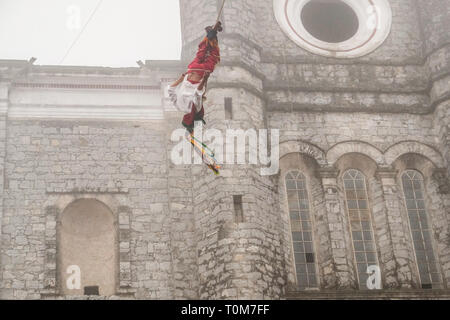 Flying Dancers in the air at Cuetzalan town center, Mexico Stock Photo