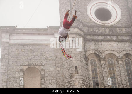 Flying Dancers in the air at Cuetzalan town center, Mexico Stock Photo