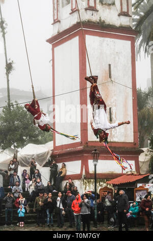 Flying Dancers in the air at Cuetzalan town center, Mexico Stock Photo