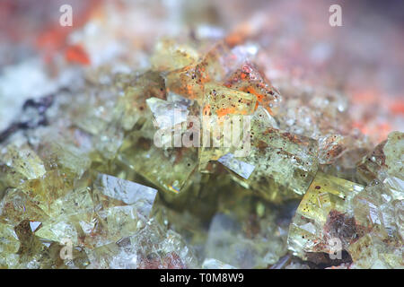 Crystals of fluorite with hematite inclusions from Illo calcite quarry in Finland Stock Photo