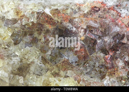 Crystals of fluorite with hematite inclusions from Illo calcite quarry in Finland Stock Photo