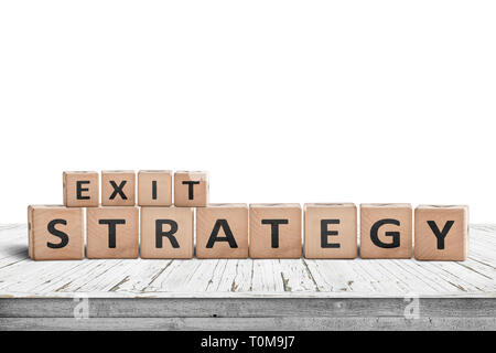 Exit strategy sign on a wooden desk isolated on white Stock Photo