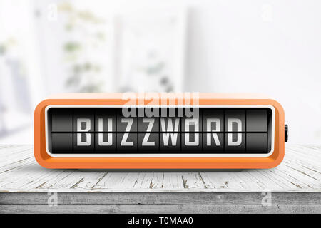 Analog device with the text buzzword on a wooden table in a bright living room Stock Photo