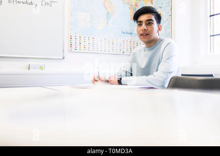 an international student studies hard in a classroom in a college in cambridge Stock Photo