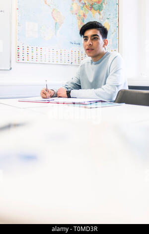 an international student studies hard in a classroom in a college in cambridge Stock Photo