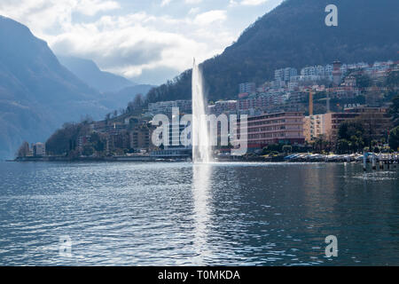 View of central Lugano with lake and fountain in March Stock Photo