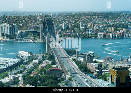 Looking towards the southern approaches and exits from the Sydney Harbour Bridge and across the harbour to the north shore. Stock Photo