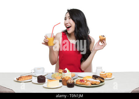 Fashionable young woman eating dessert Stock Photo