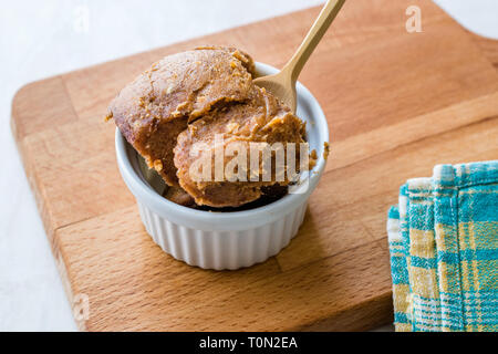 Japanese Miso Paste with Wooden Spoon. Traditional Organic Food. Stock Photo