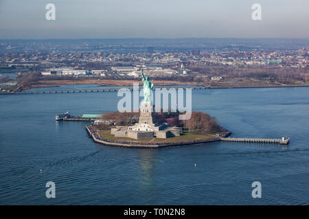 Aerial view of Liberty Island and the Statue of Liberty from a helicopter tour, New York Harbour, New York, USA, The United States of America Stock Photo